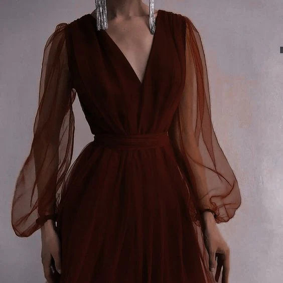Close-up of the V-neckline and bodice of a formal evening dress.