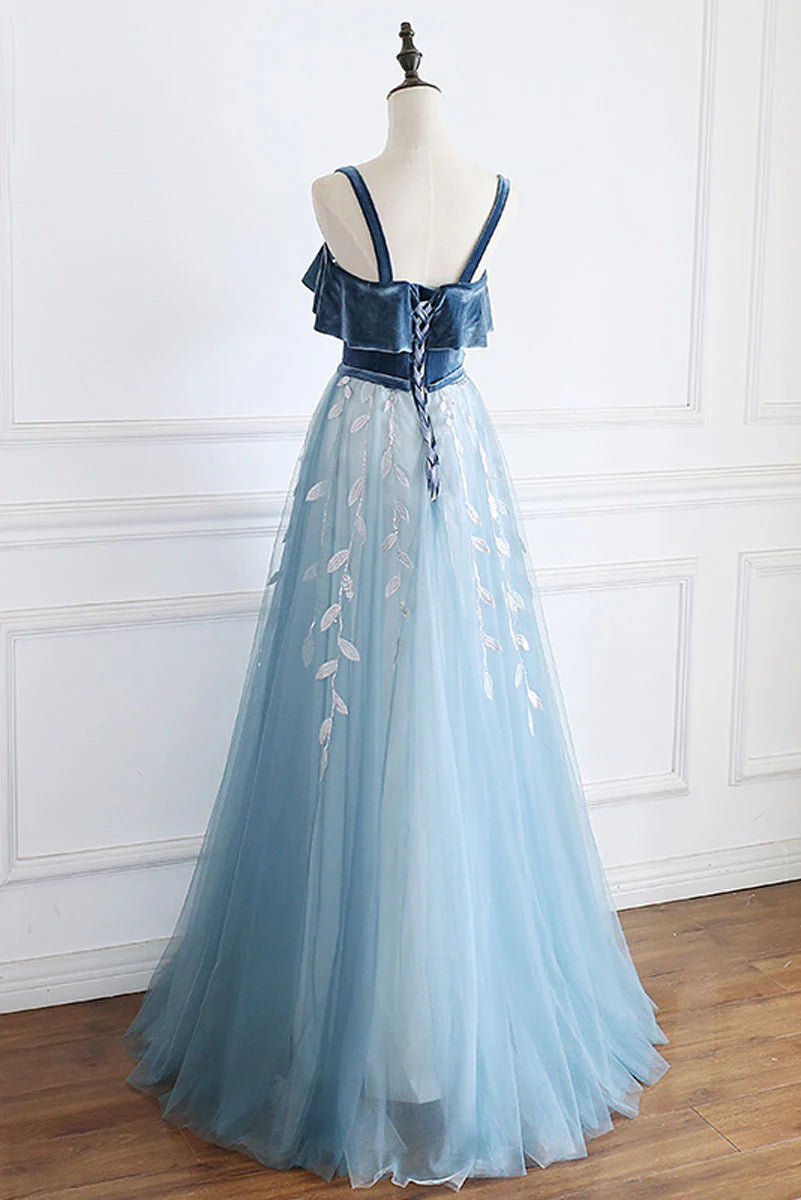 Side view of blue tulle lace formal gown with flowing skirt.