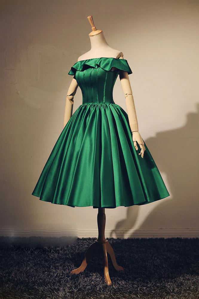 Elegant green short prom dress with V-neck and A-line silhouette, modeled from the front.