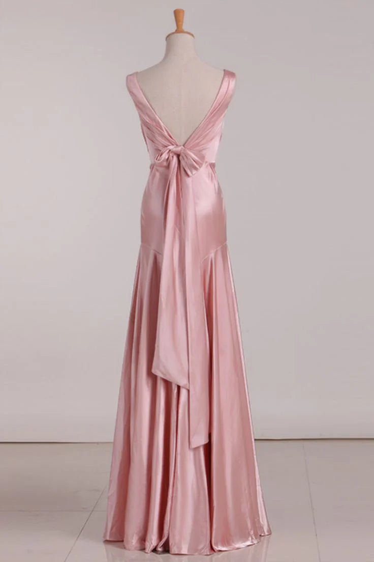 Close-up of the back of a pink V-neck mermaid bridesmaid dress showing the tie-back detail.