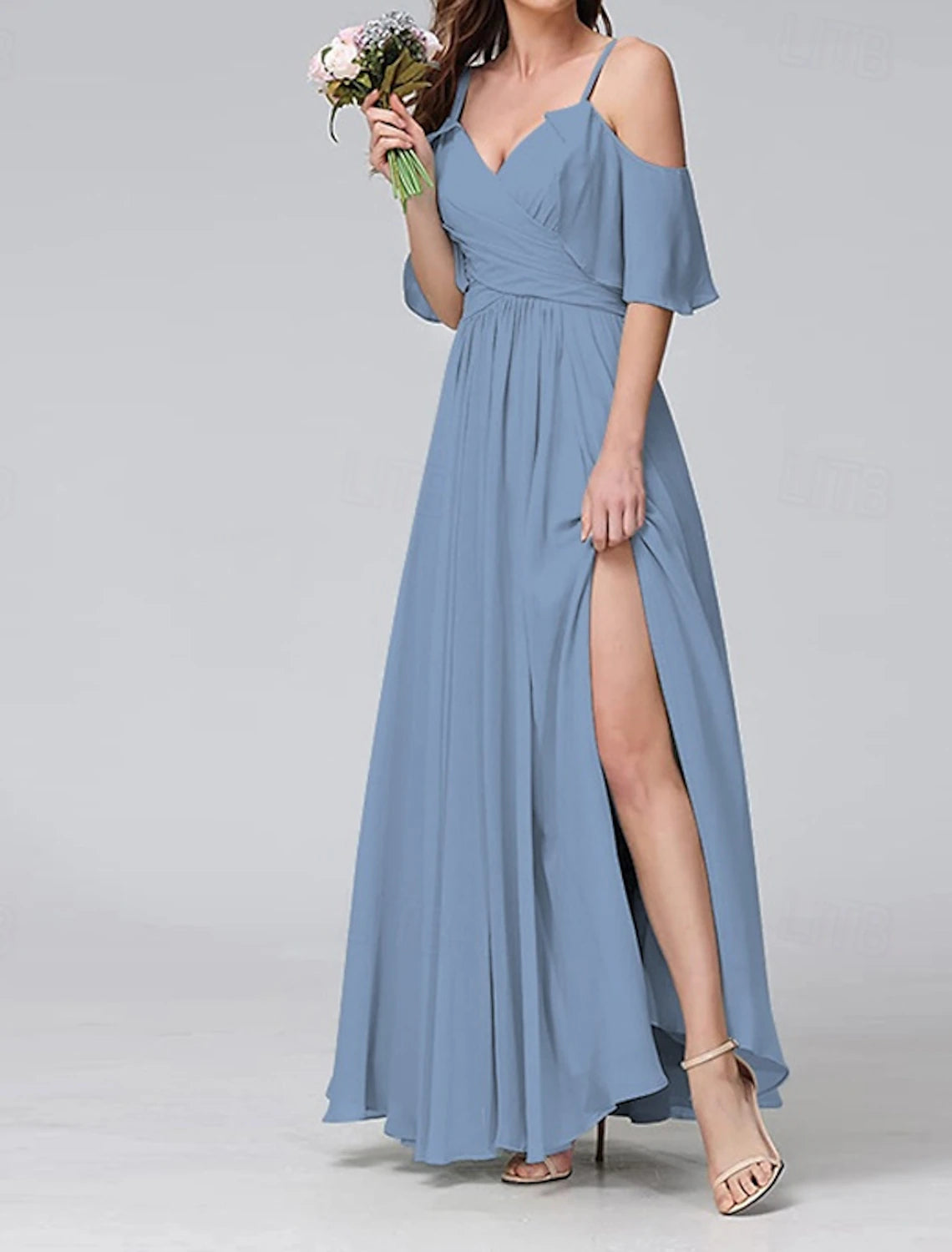 Woman wearing an elegant V-neck short sleeve maxi dress, side view.