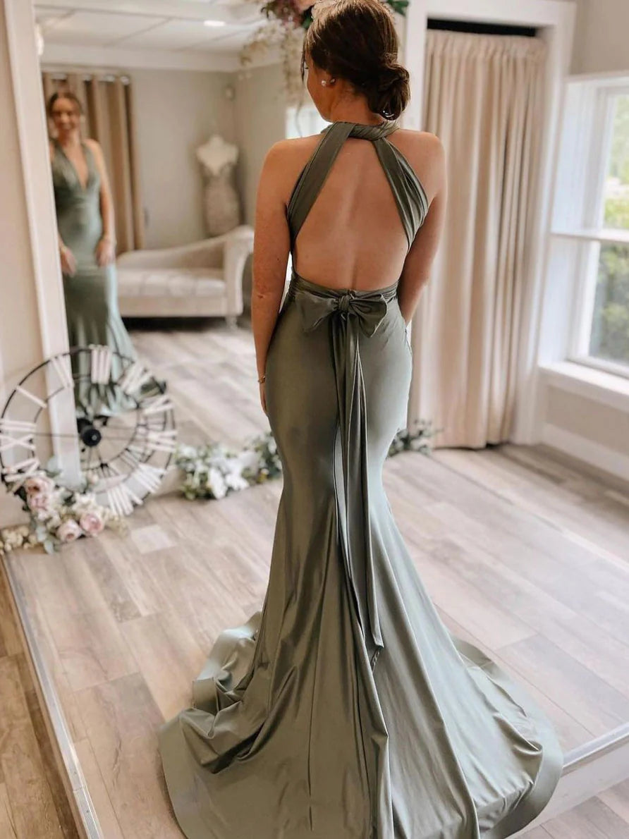 Model showcasing the back of a gray-green satin mermaid long evening dress.
