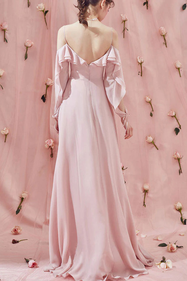 Back view of the pink chiffon long prom dress, showing flowing fabric.