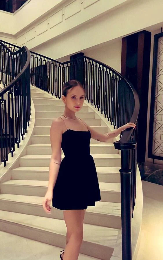 Full view of a short velvet party dress with V-neck.