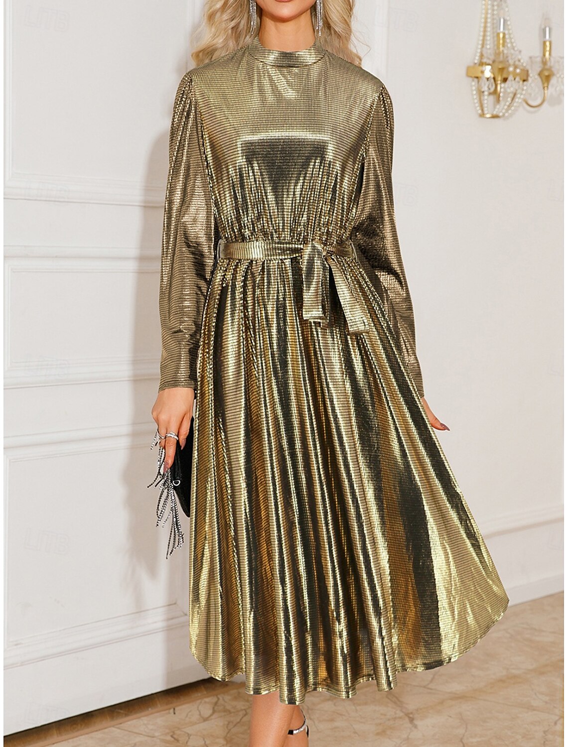 Woman wearing an elegant gold patchwork maxi dress with a stand collar.
