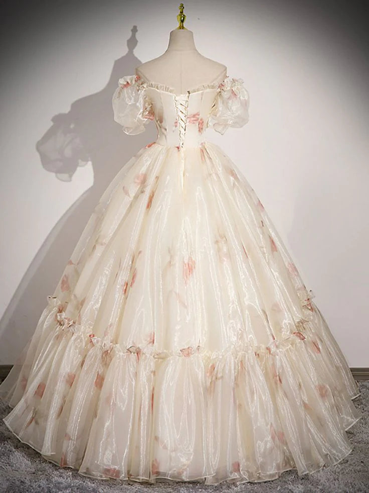 Woman wearing a floral chiffon A-line evening dress, back view.