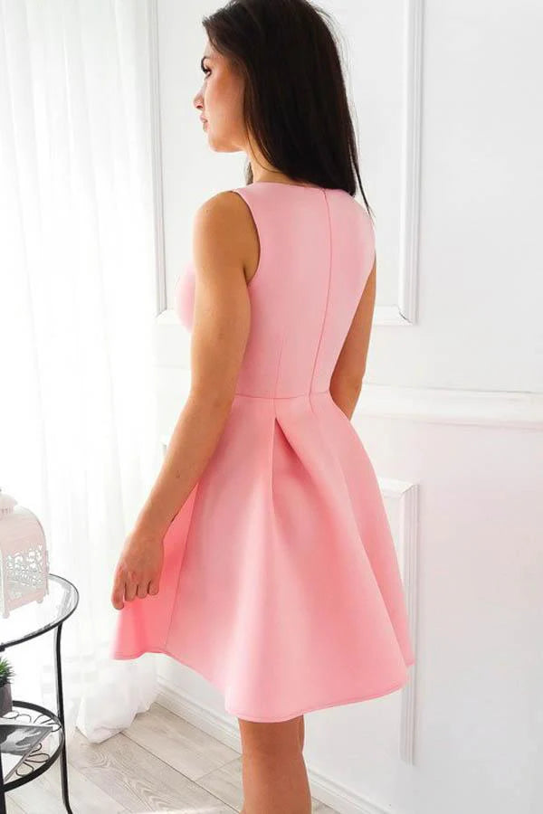 Back view of a model in a pink satin short homecoming dress, showcasing the A-line skirt.