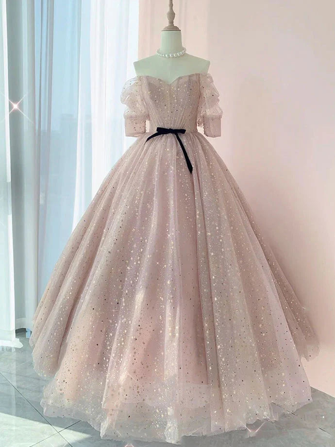 Champagne tulle long evening dress with a flowing skirt.
