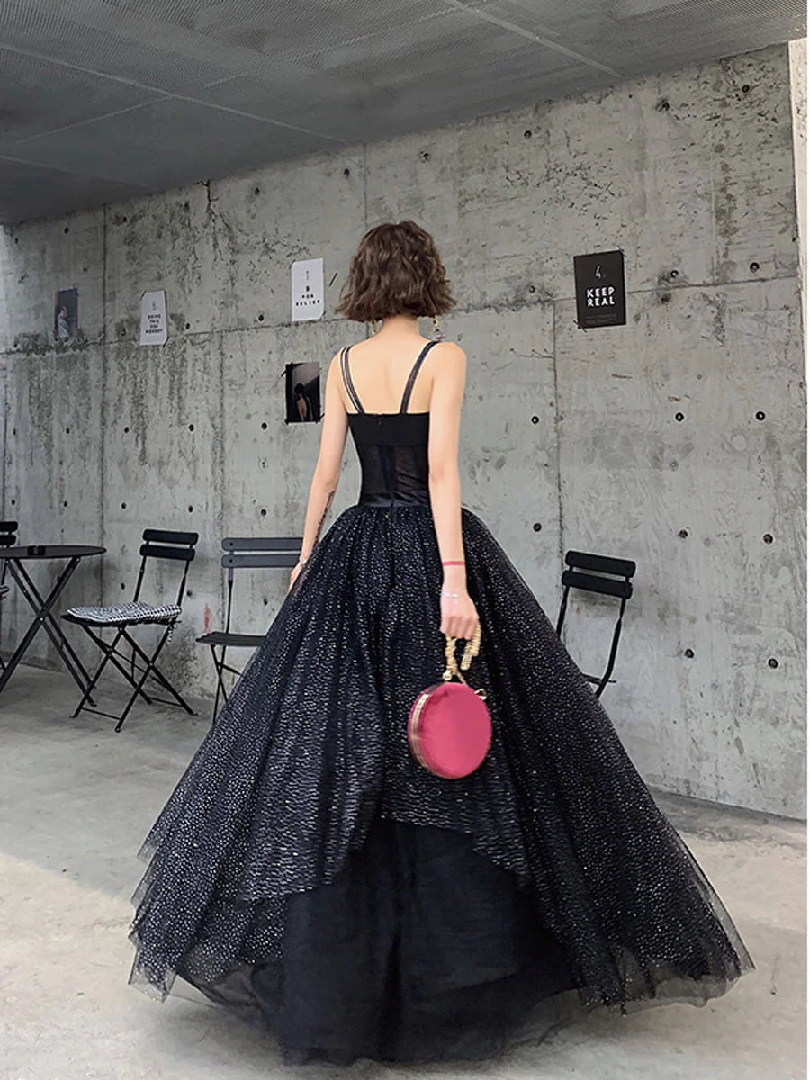 Full view of a black sequin tulle formal dress with spaghetti straps.