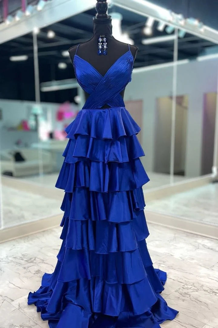 Confident woman posing in a V-neck spaghetti strap prom dress, perfect for special occasions.
