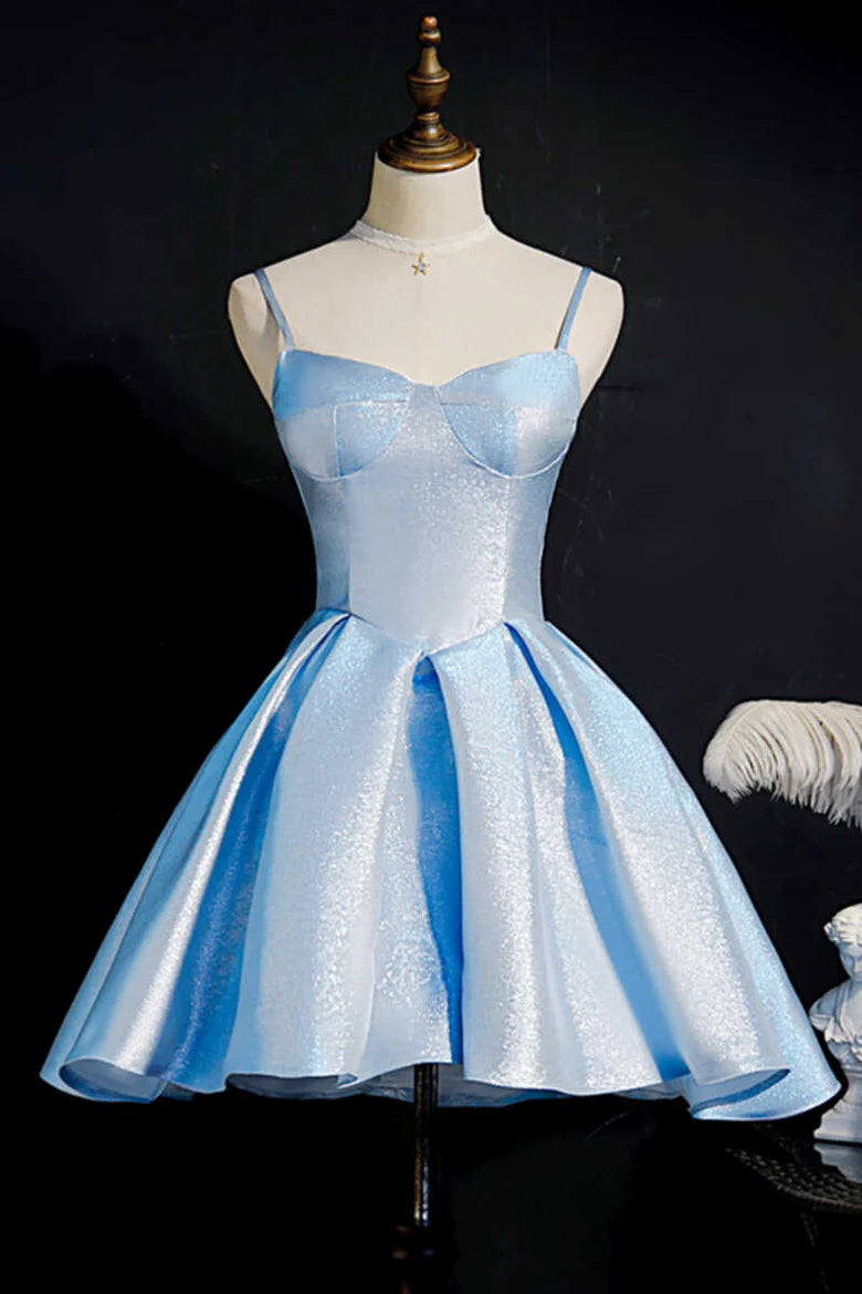 Model wearing a glitter blue satin short party dress with delicate straps and princess seams.