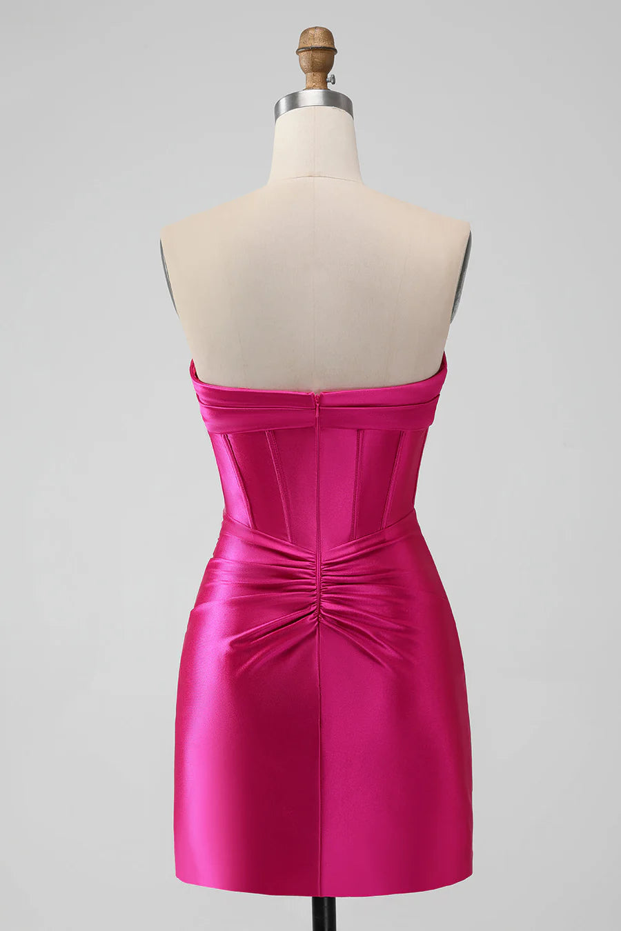 Back view of the hot pink slim-fit mini homecoming dress on a model.