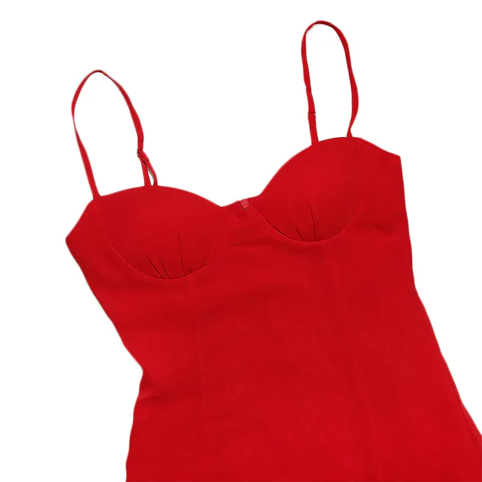 Detail of the smooth, lustrous fabric of the red A-line mini dress.