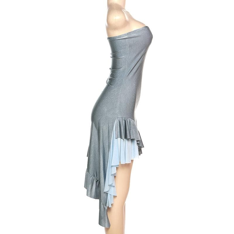 Model posing in the shimmering grey dress, showcasing the ruffled layers.
