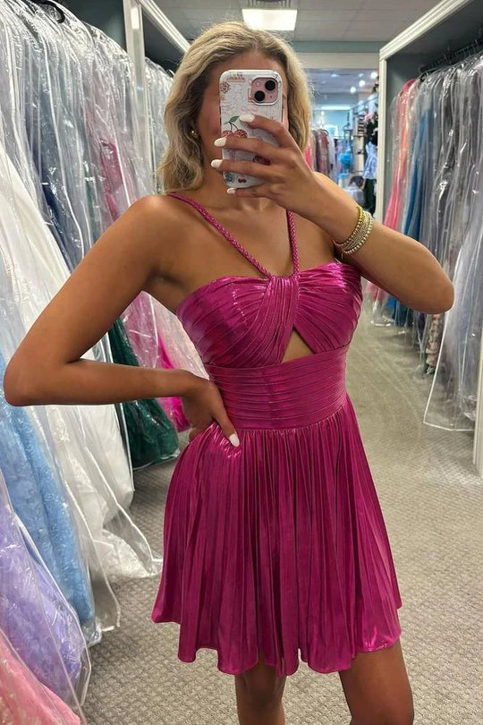 Side view of a woman in the metallic pleated A-line dress, highlighting the silhouette.