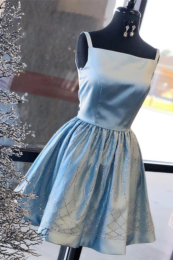Shiny blue satin knee-length homecoming dress with square neckline and beading, back view.
