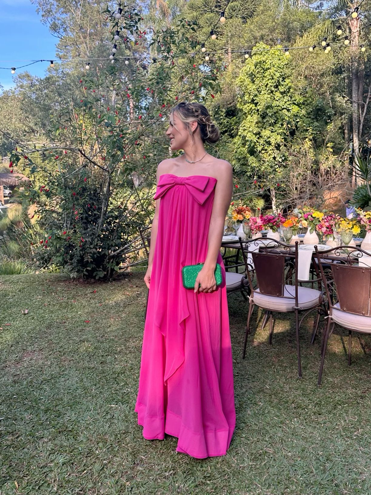 Elegant pink chiffon strapless ball gown with a flowing skirt.