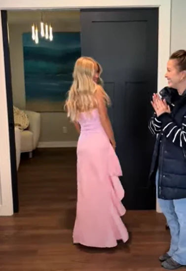 Model wearing a pink satin off-shoulder A-line prom dress.