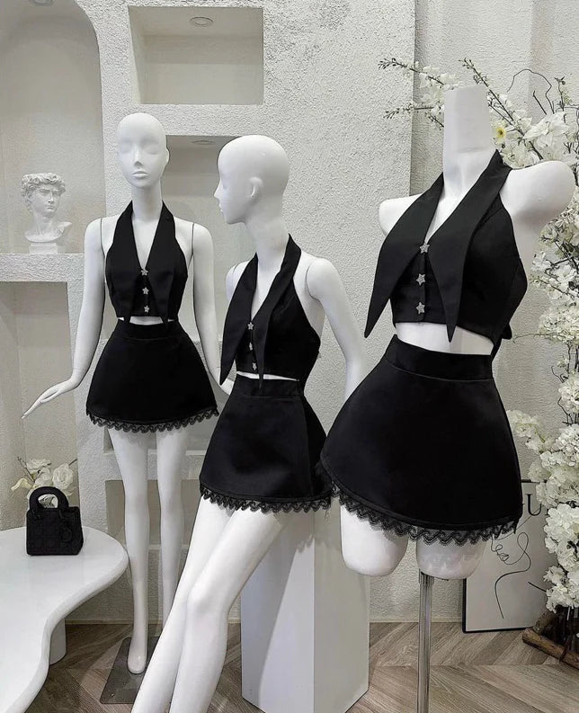 Close-up of the satin and lace fabric of the two-piece short homecoming dress with a bow detail.