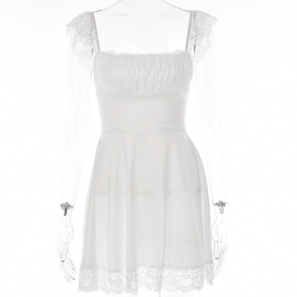 Close-up of the square neckline and ruffle cap sleeves of the white homecoming dress.