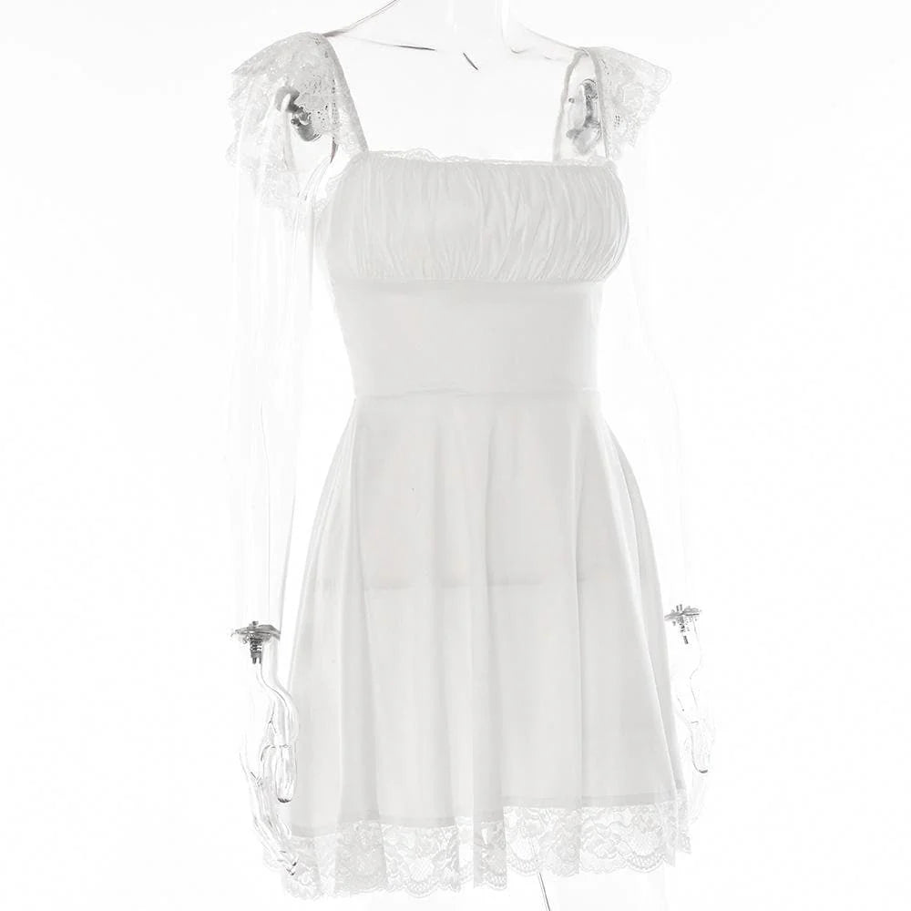 Back view of the white homecoming dress showing the corset-style lace-up detail.
