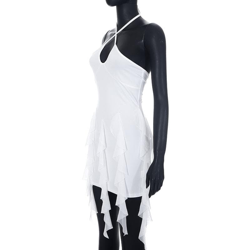 Detail of the asymmetrical layered ruffles on the skirt of the white mini dress.